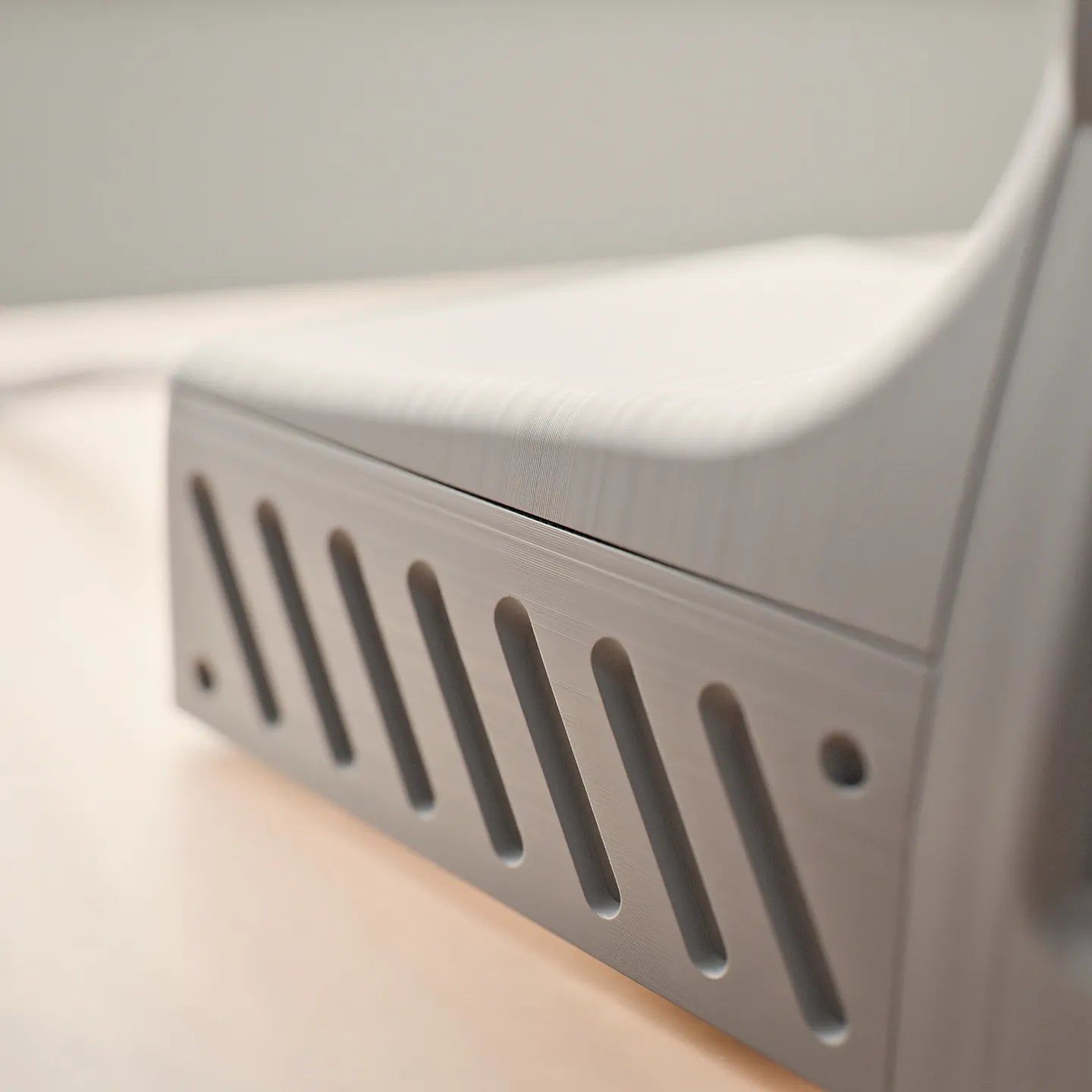 Close-up of the vented side of a Charcoal Black DeskOrbie 2