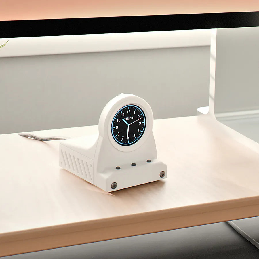 Frost White DeskOrbie 2 with an analog clock face below a monitor